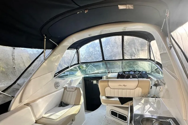 Slide: The Image of Interior of 2013 Sea Ray 280 Sundancer boat with seating and helm. - 9