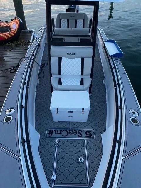 Slide: The Image of 1975 SeaCraft 23 Potter Hull boat with custom deck and seating. - 3