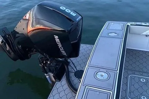 Slide: The Image of 1975 SeaCraft 23 Potter Hull with Mercury outboard motor on calm water. - 4