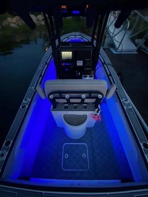 Slide: The Image of 1975 SeaCraft 23 Potter Hull boat interior with blue LED lighting. - 6