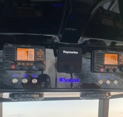 Slide: The Image of 1975 SeaCraft 23 Potter Hull dashboard with Raymarine electronics and Icom radios. - 8