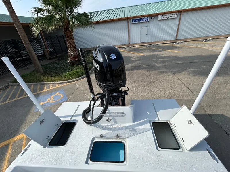 Slide: The Image of 2025 Shallow Stalker Cat 204 boat with Suzuki outboard motor in parking lot. - 14