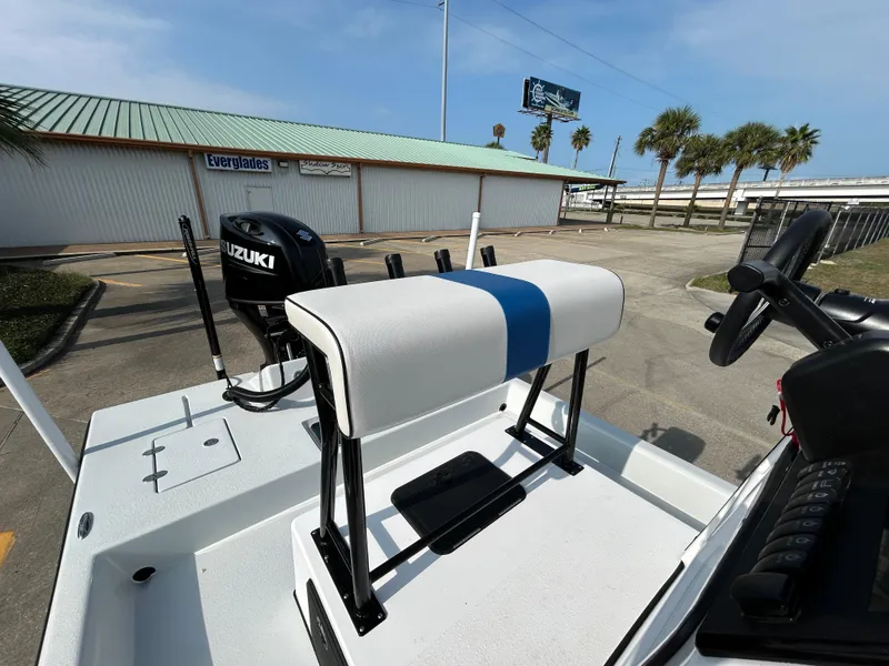 Slide: The Image of Shallow Stalker Cat 204 boat, 2025 model, with Suzuki engine, docked near palm trees. - 16