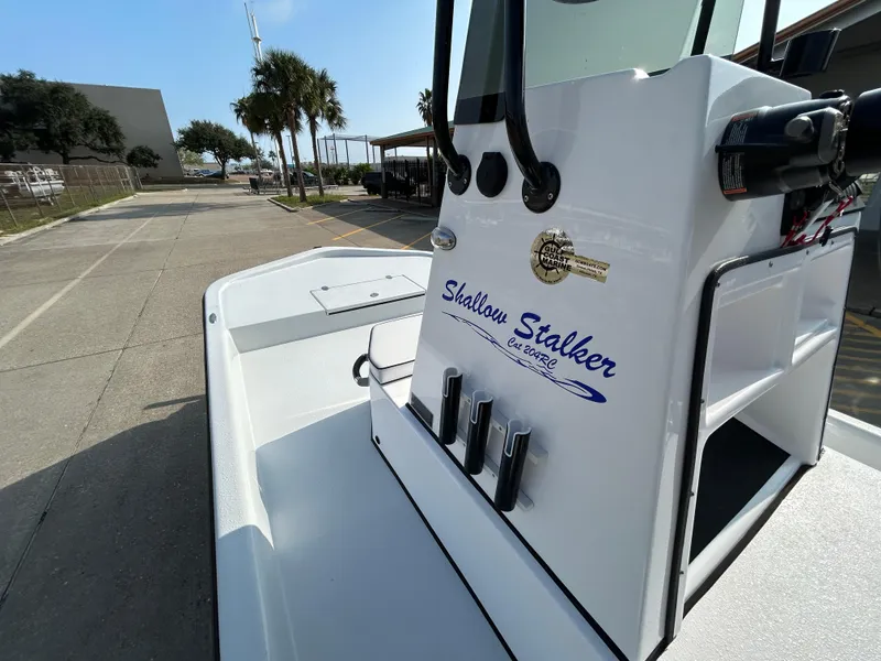 Slide: The Image of 2025 Shallow Stalker Cat 204 boat, white exterior, parked outdoors on a sunny day. - 9