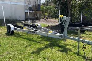 Slide: The Image of Boat trailer on grass, compatible with 2006 Andros Tarpon model. - 13