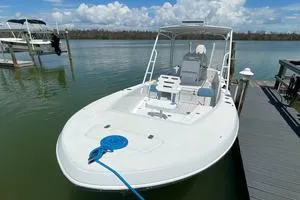 Slide: The Image of 2006 Andros Tarpon boat docked on calm water under a clear sky. - 4