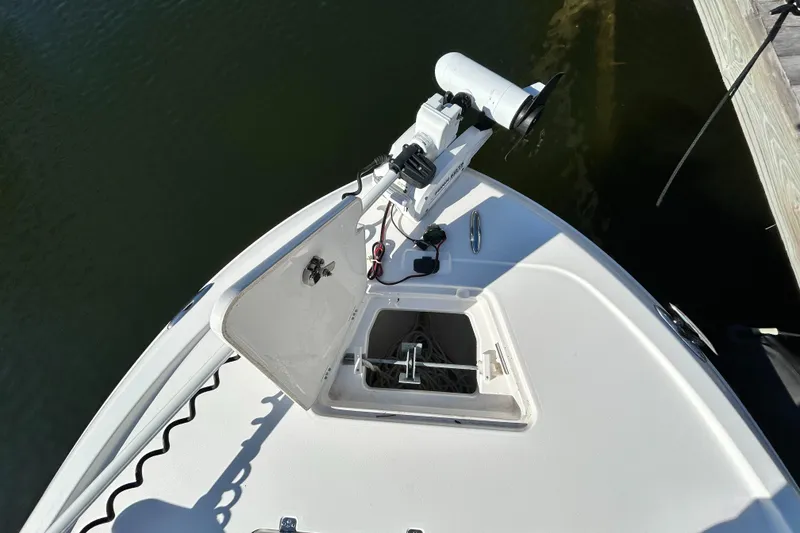 Slide: The Image of 2021 Caymas 28 HB boat bow with anchor compartment and trolling motor. - 19