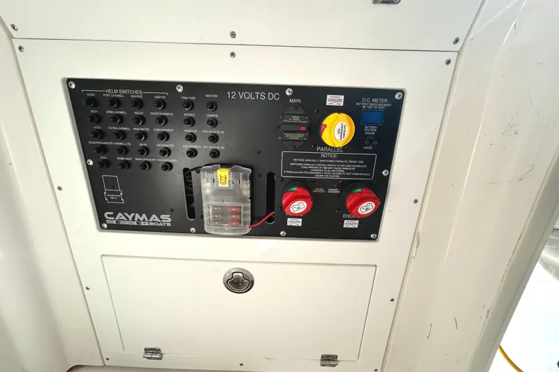Slide: The Image of Electrical panel of 2021 Caymas 28 HB boat with switches and battery controls. - 30