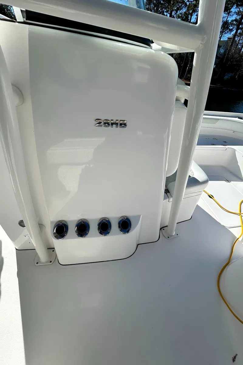 Slide: The Image of 2021 Caymas 28 HB boat interior with control panel and seating area. - 32