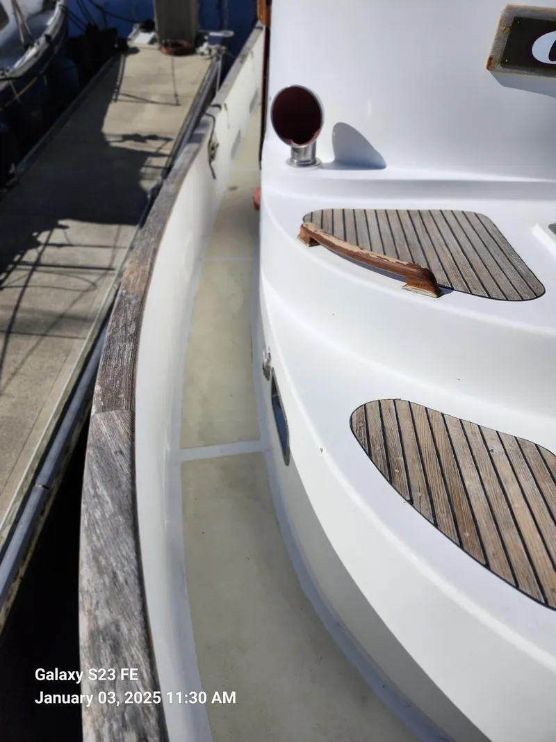 Slide: The Image of Close-up of 1988 Lord Nelson Victory 37 yacht deck with wooden accents. - 13