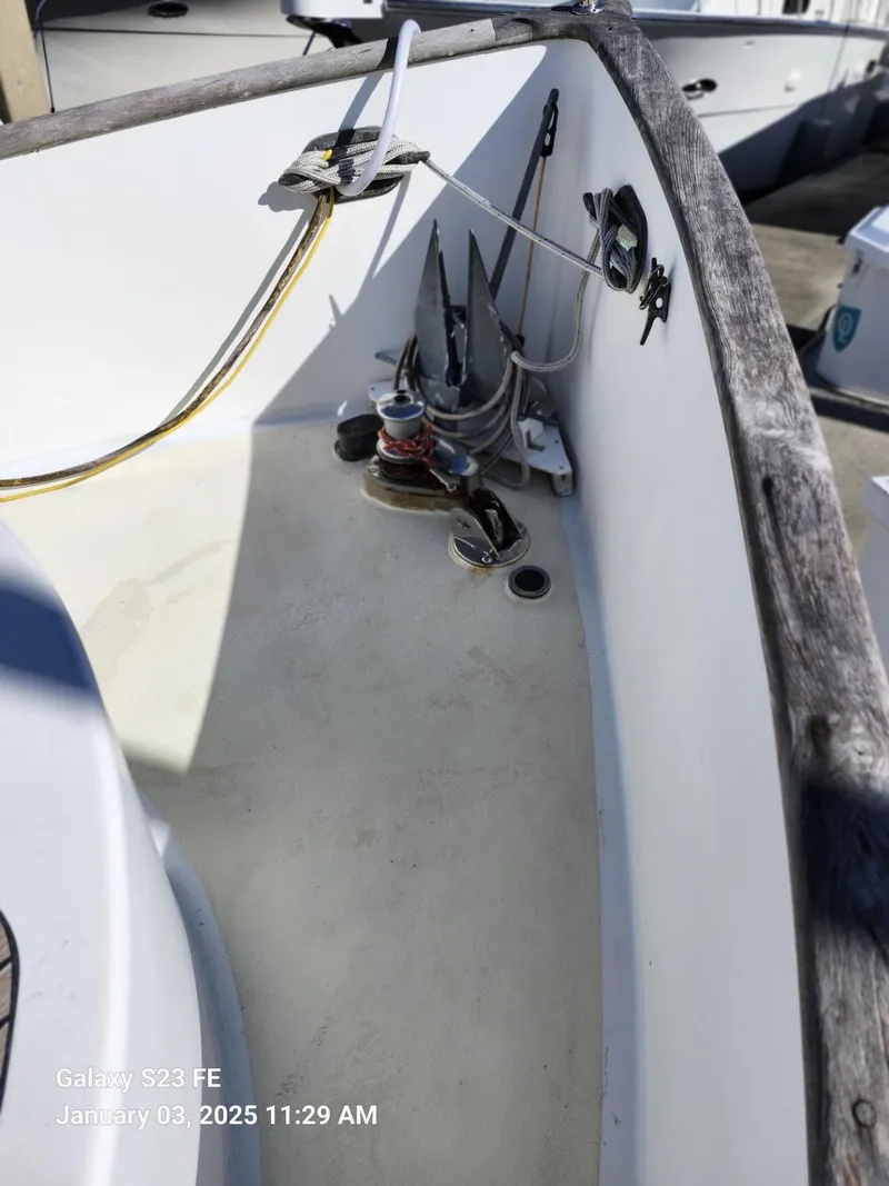 Slide: The Image of 1988 Lord Nelson Victory 37 sailboat deck with anchor and winch. - 14