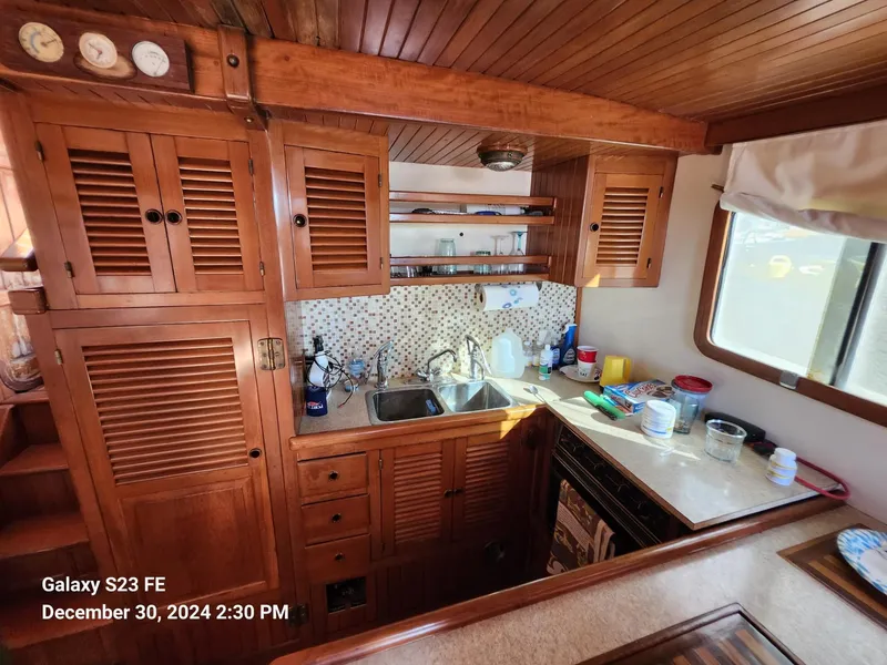 Slide: The Image of Cozy wooden kitchen interior on 1988 Lord Nelson Victory 37 yacht. - 38