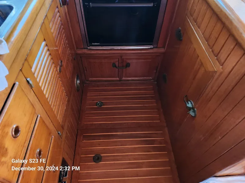 Slide: The Image of Wooden interior of 1988 Lord Nelson Victory 37 boat galley. - 39