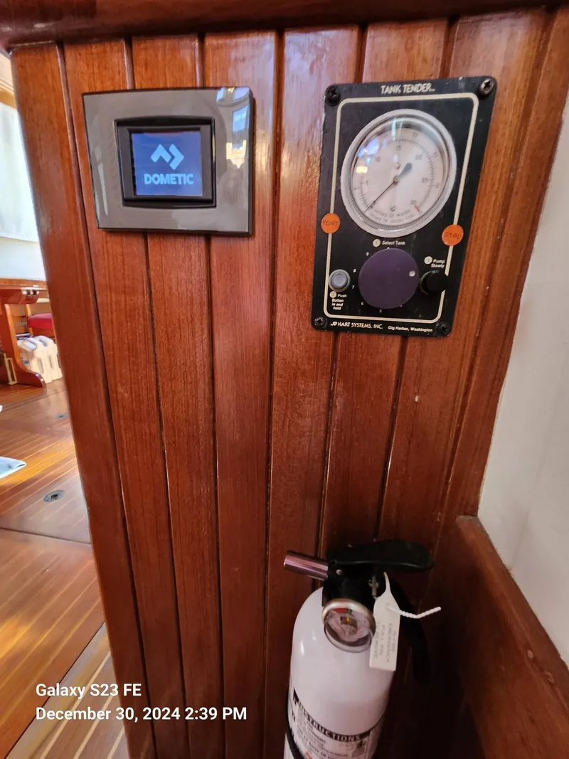 Slide: The Image of Interior of 1988 Lord Nelson Victory 37 yacht with control panel and fire extinguisher. - 48