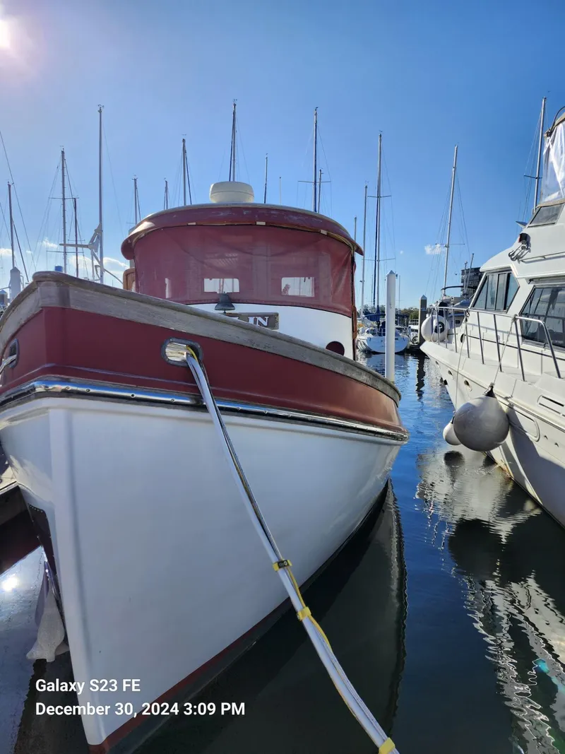 Slide: The Image of 1988 Lord Nelson Victory 37 boat docked in sunny marina. - 6