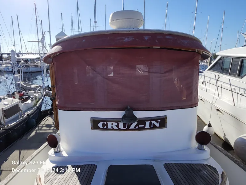 Slide: The Image of 1988 Lord Nelson Victory 37 boat named "CRUZ-IN" docked at marina. - 9