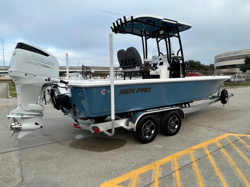 Slide: The Image of 2024 Sea Pro 250 DLX boat with Suzuki outboard motor on trailer. - 5