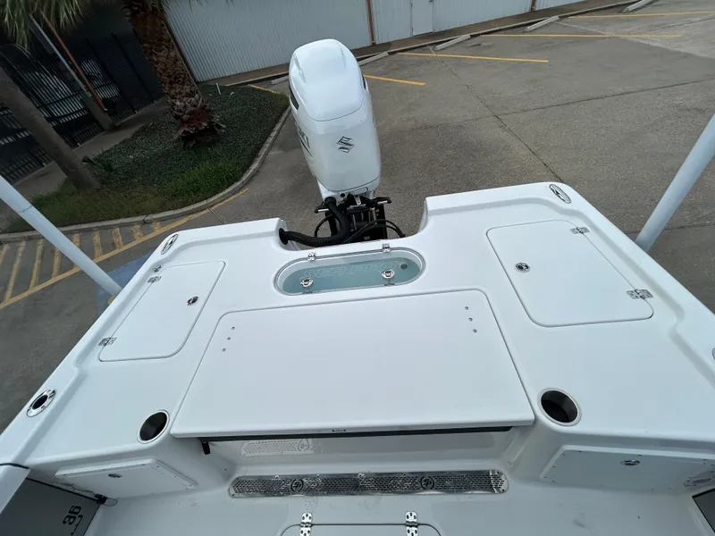 Slide: The Image of 2024 Sea Pro 250 DLX boat deck with outboard motor, viewed from above. - 8