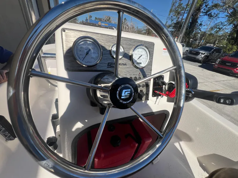 Slide: The Image of Steering wheel and dashboard of 2025 Carolina Skiff E 16 JVX boat. - 12