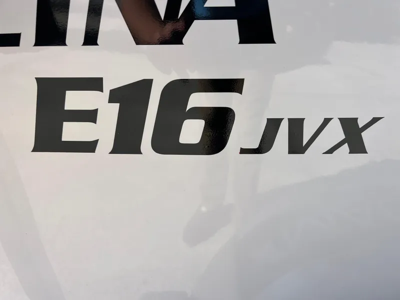 Slide: The Image of 2025 Carolina Skiff E 16 JVX model logo on boat exterior. - 21