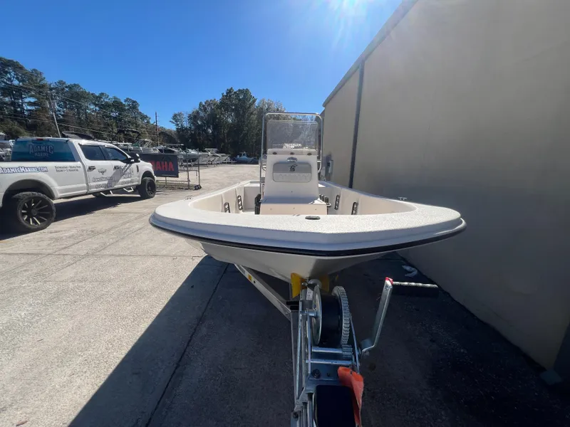 Slide: The Image of 2025 Carolina Skiff E 16 JVX boat on trailer in sunny outdoor setting. - 4