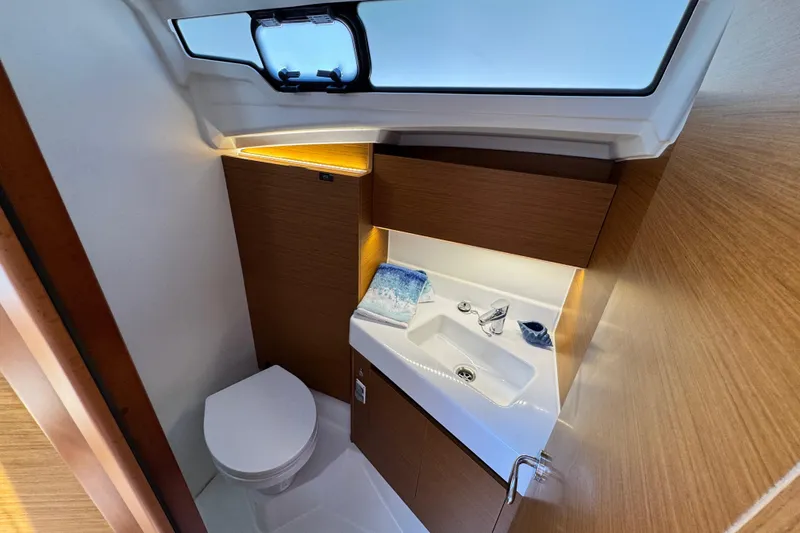 Slide: The Image of Modern bathroom in 2025 Jeanneau Sun Odyssey 350 yacht, featuring sleek design and compact amenities. - 20