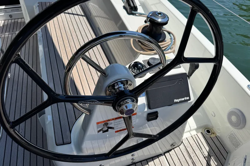 Slide: The Image of Steering wheel of 2025 Jeanneau Sun Odyssey 350 sailboat with Raymarine equipment. - 22