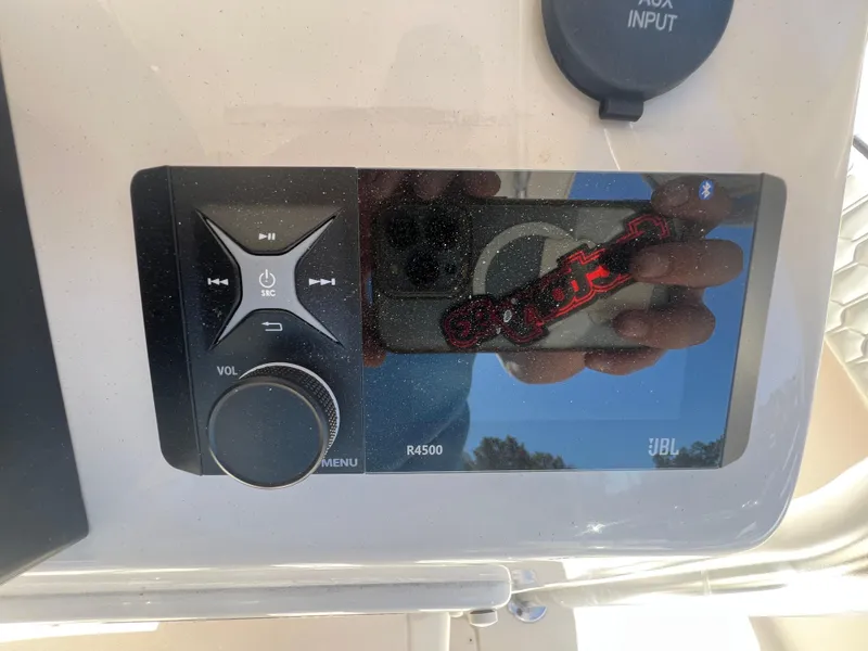 Slide: The Image of JBL R4500 audio system on 2025 Sea Chaser 22 HFC boat dashboard. - 16
