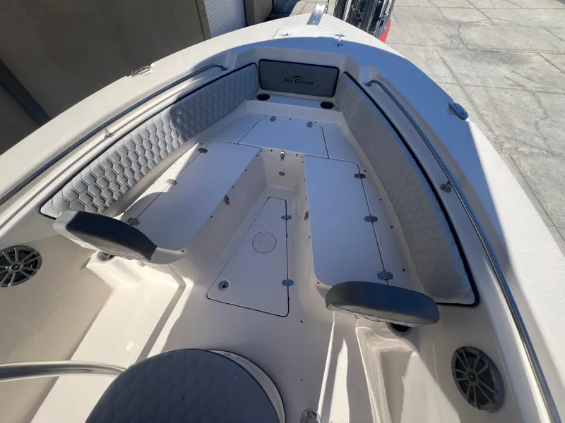 Slide: The Image of 2025 Sea Chaser 22 HFC boat interior with cushioned seating and storage compartments. - 19