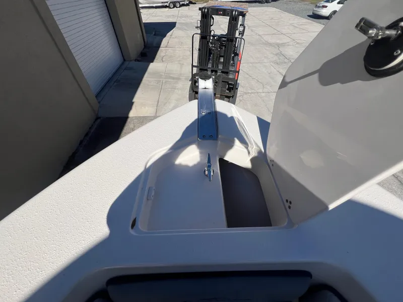 Slide: The Image of 2025 Sea Chaser 22 HFC boat with open storage compartment on deck. - 22