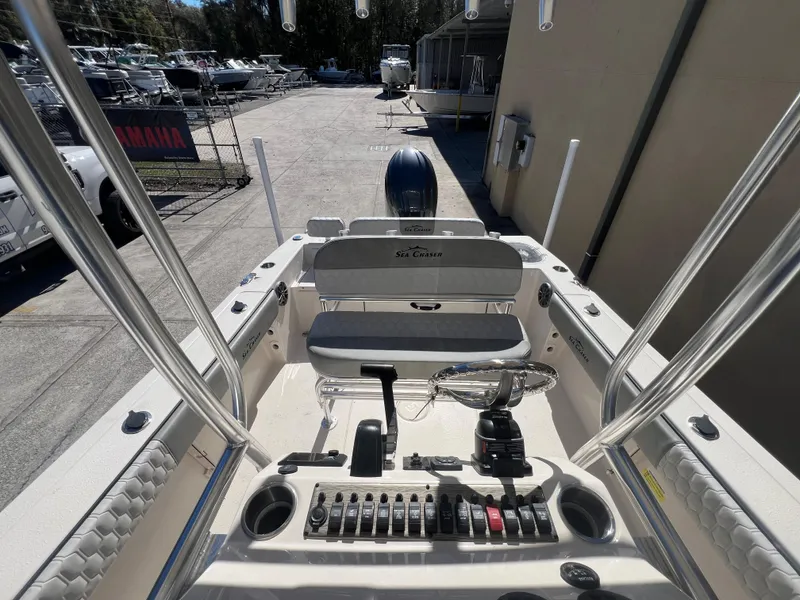 Slide: The Image of 2025 Sea Chaser 22 HFC boat interior with control panel and seating. - 26
