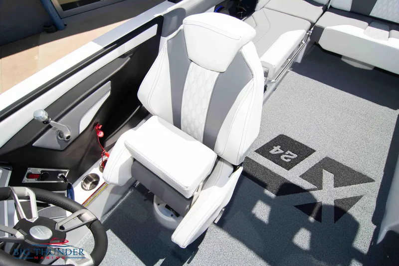 Slide: The Image of 2024 MasterCraft NXT24 boat interior with sleek seating and modern design. - 41