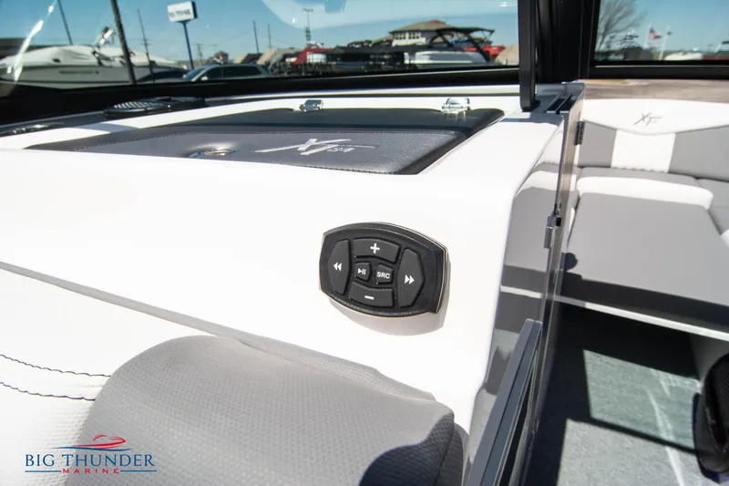 Slide: The Image of 2024 MasterCraft NXT24 boat interior with control panel and seating. - 44