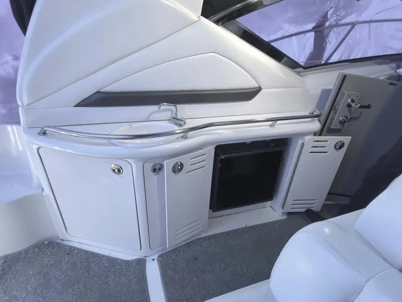 Slide: The Image of 2003 Sea Ray 420 Sundancer interior with sleek cabinetry and modern design elements. - 12