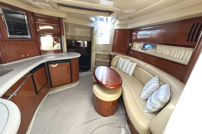 Slide: The Image of Luxurious interior of 2003 Sea Ray 420 Sundancer yacht with elegant seating and modern amenities. - 21