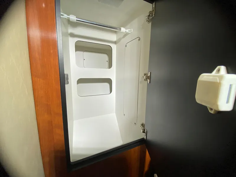 Slide: The Image of Empty storage compartment inside a 2003 Sea Ray 420 Sundancer boat. - 39