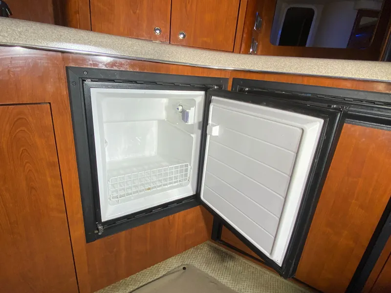 Slide: The Image of Open mini fridge in 2003 Sea Ray 420 Sundancer yacht interior. - 40