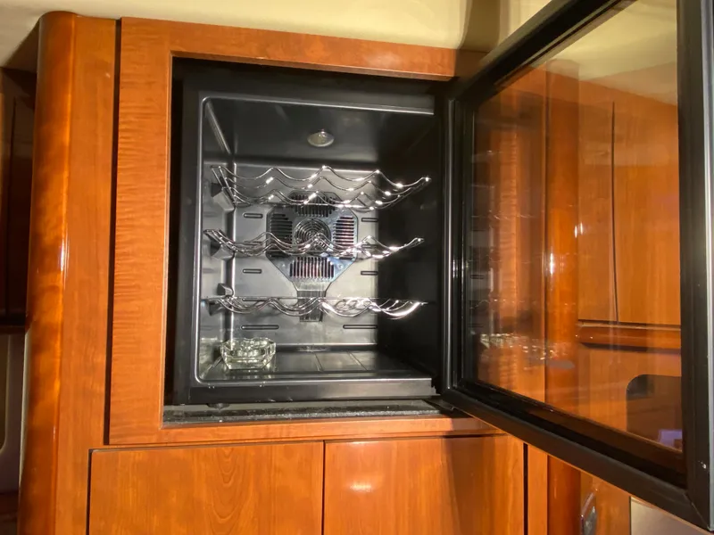 Slide: The Image of Wine cooler inside 2003 Sea Ray 420 Sundancer yacht with wooden cabinetry. - 45