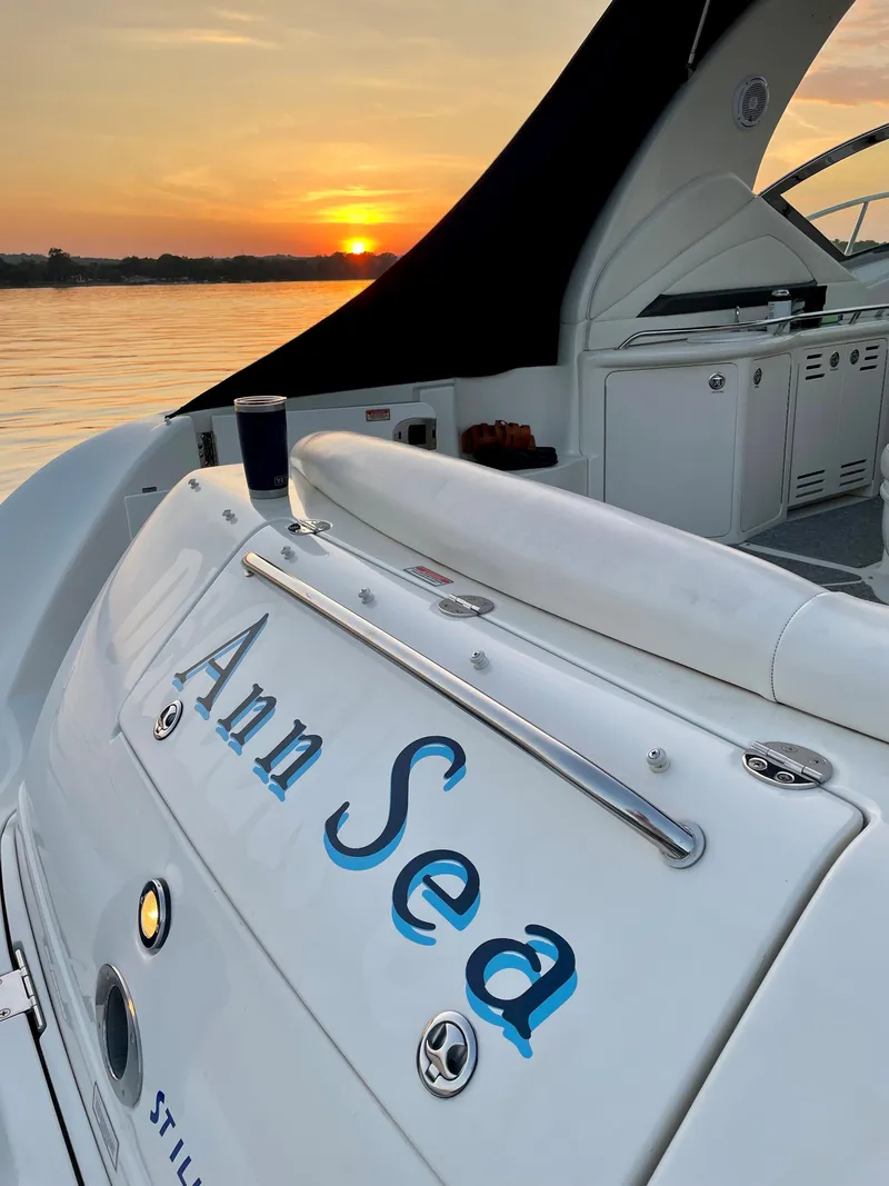 Slide: The Image of 2003 Sea Ray 420 Sundancer yacht at sunset, featuring "Ann Sea" on the stern. - 7