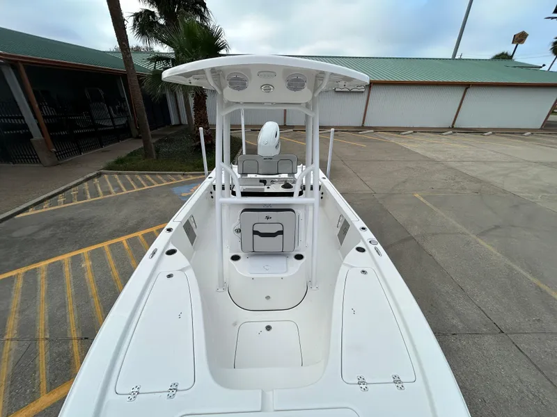 Slide: The Image of 2025 Sea Pro 210 Bay boat, white deck, center console, outdoor setting. - 10