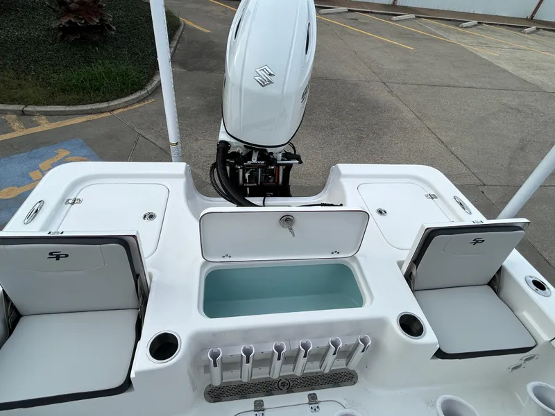 Slide: The Image of 2025 Sea Pro 210 Bay boat with motor and storage compartments. - 13