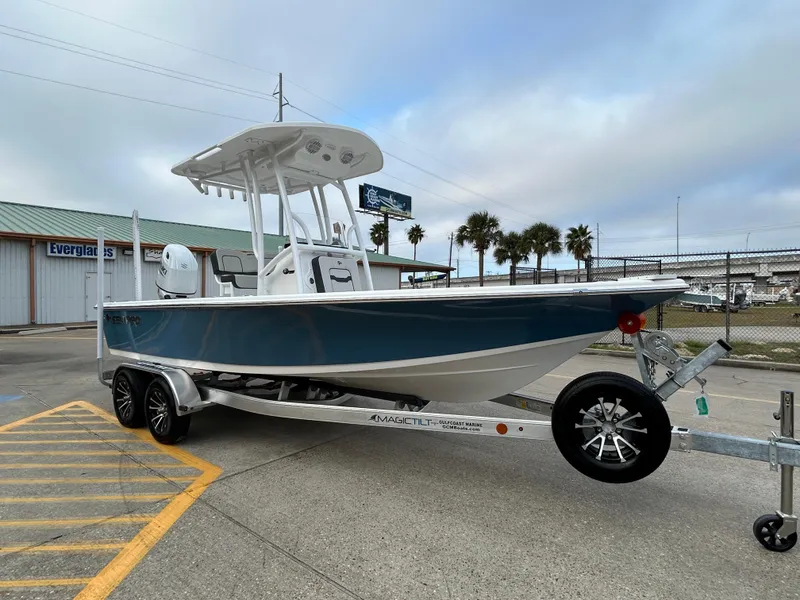 Slide: The Image of 2025 Sea Pro 210 Bay boat on trailer, parked outdoors. - 3
