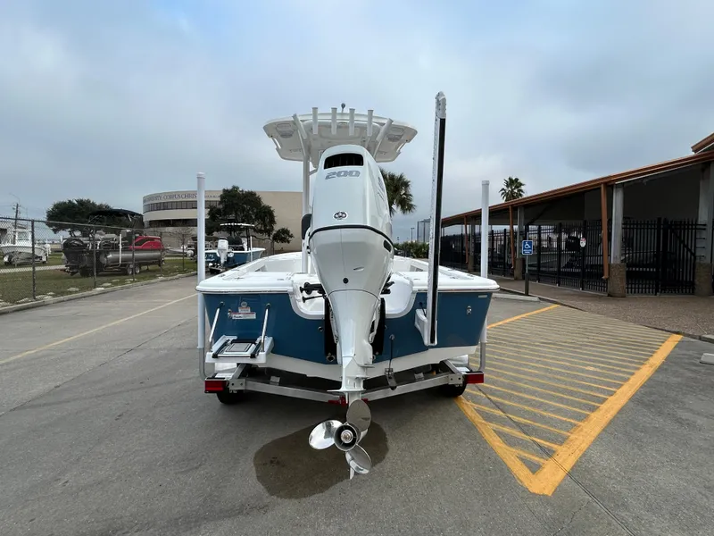 Slide: The Image of 2025 Sea Pro 210 Bay boat, rear view, parked on a street. - 5