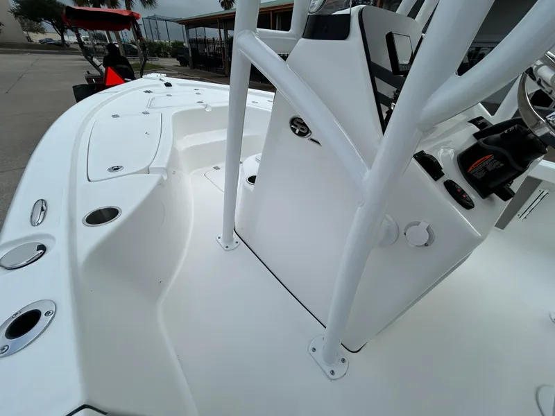 Slide: The Image of 2025 Sea Pro 210 Bay boat interior with white console and seating area. - 6