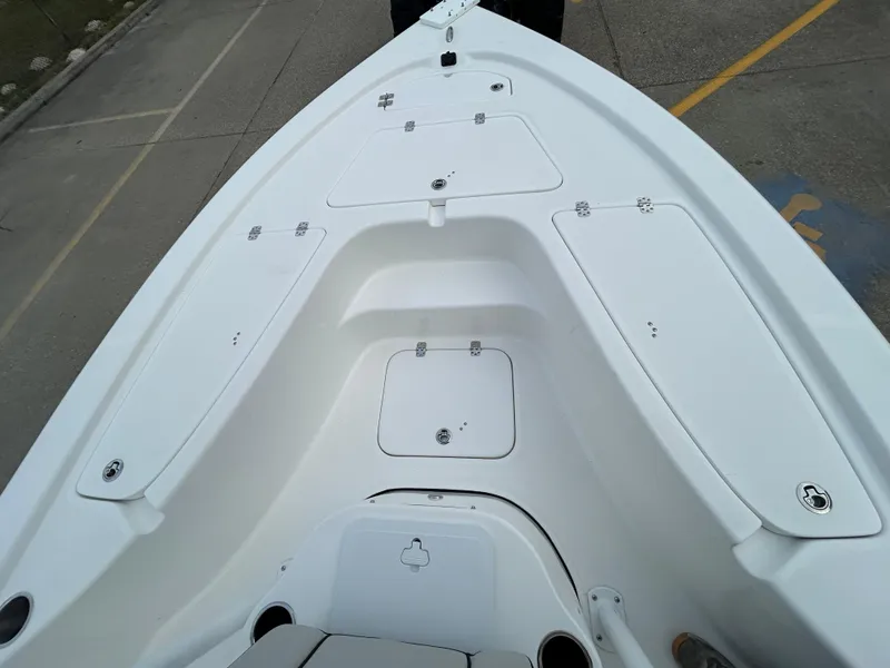 Slide: The Image of 2025 Sea Pro 210 Bay boat deck with storage compartments. - 8