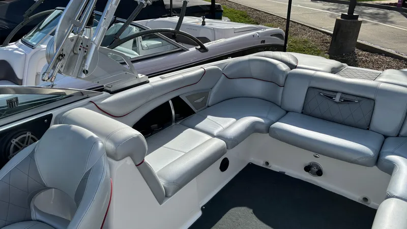 Slide: The Image of 2013 MasterCraft X55 boat interior with luxurious white seating. - 10