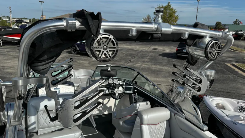 Slide: The Image of 2013 MasterCraft X55 boat interior with speakers and wakeboard racks. - 12