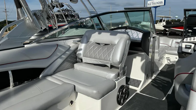 Slide: The Image of 2013 MasterCraft X55 boat interior with luxurious seating and modern dashboard. - 14