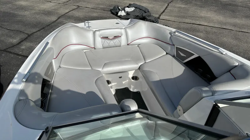 Slide: The Image of 2013 MasterCraft X55 boat interior with gray seating and modern design. - 18