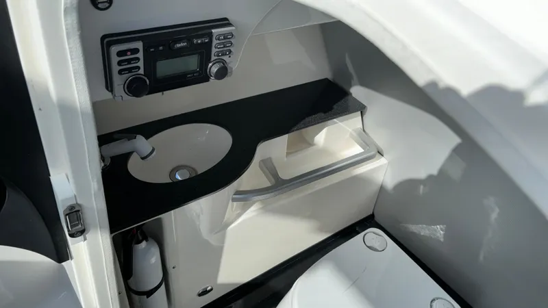Slide: The Image of 2013 MasterCraft X55 boat interior with sink and stereo system. - 22